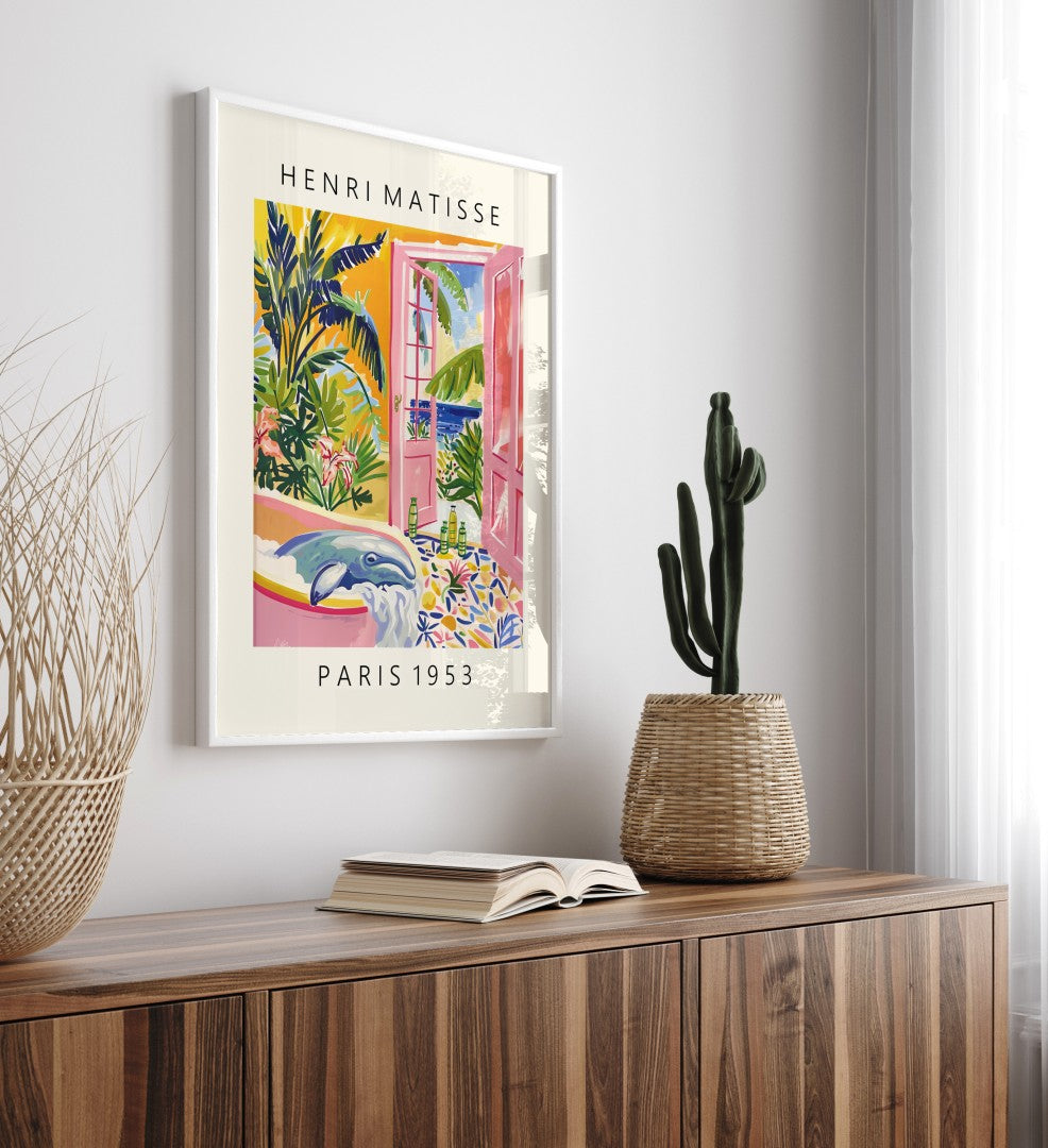 Tropical framed artwork of a whale lounging in a tub with open pink doors and a lush ocean setting, Matisse-inspired.