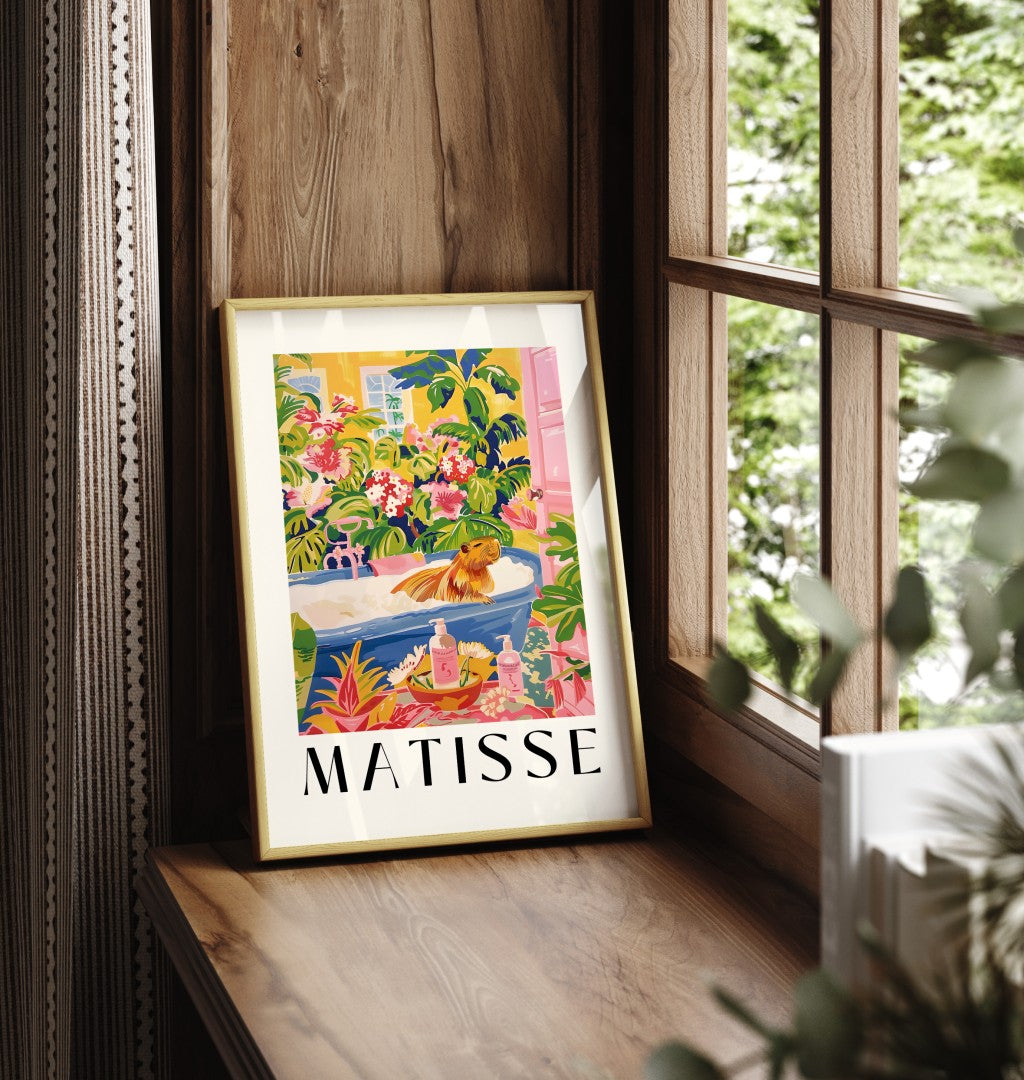 Matisse-style framed wall art featuring a capybara in a bath with bold greenery and floral details.