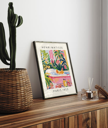 Framed Henri Matisse inspired art print of a brown chicken bathing in a pink tub among tropical plants - bathroom wall art print for decor