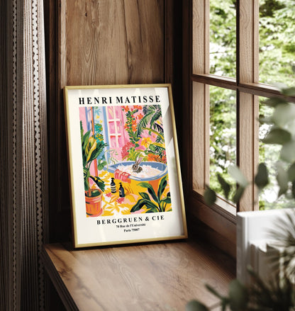 Framed bathroom artwork with a rabbit in a colorful vintage tub, inspired by Matisse.